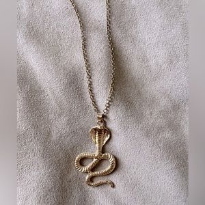 Gold cobra necklace